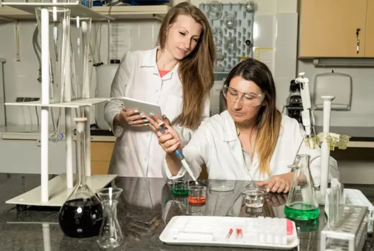 Expert testing beauty product sample in lab